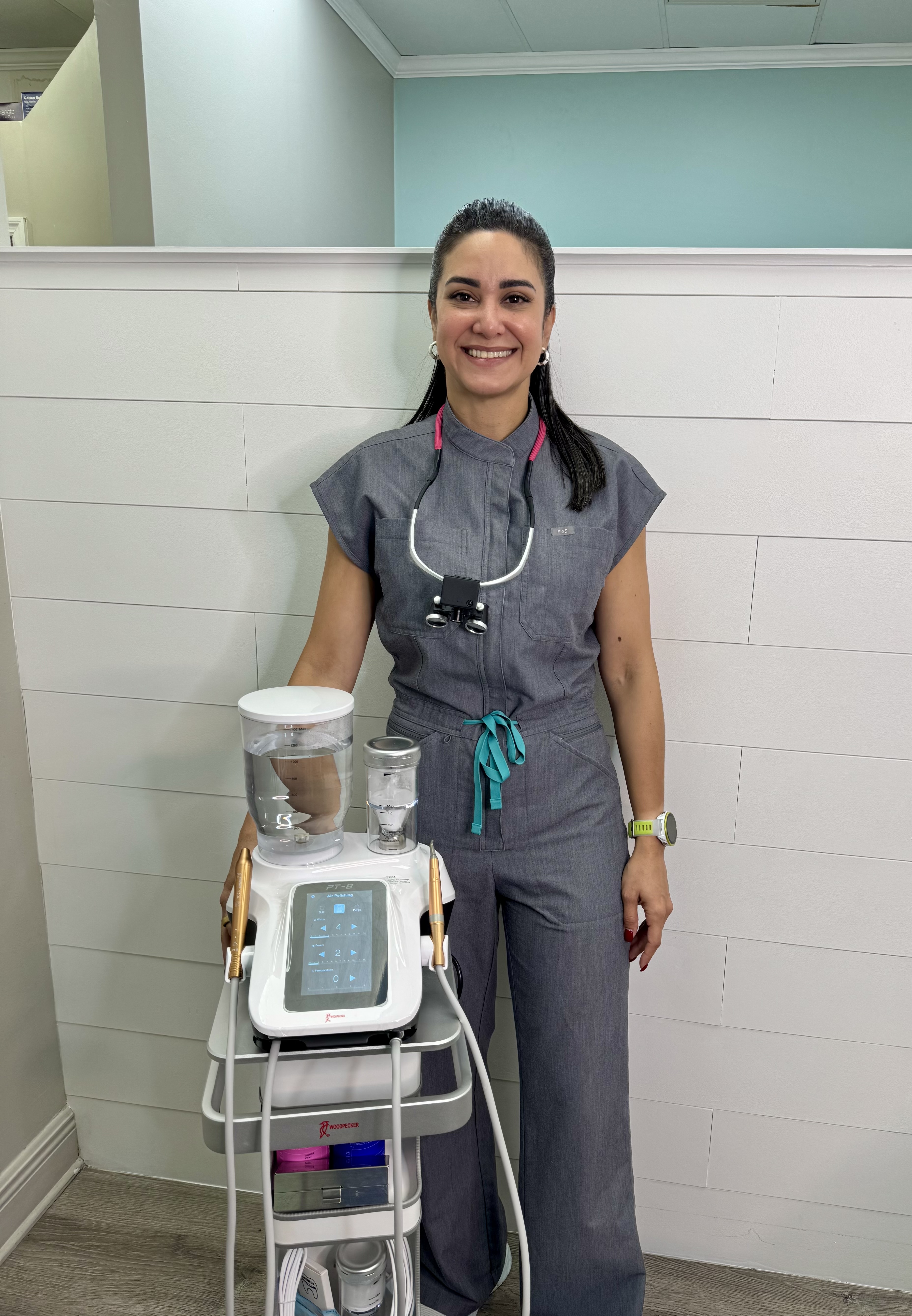 Our hygienist with the AirFlow Guided Biofilm Therapy unit